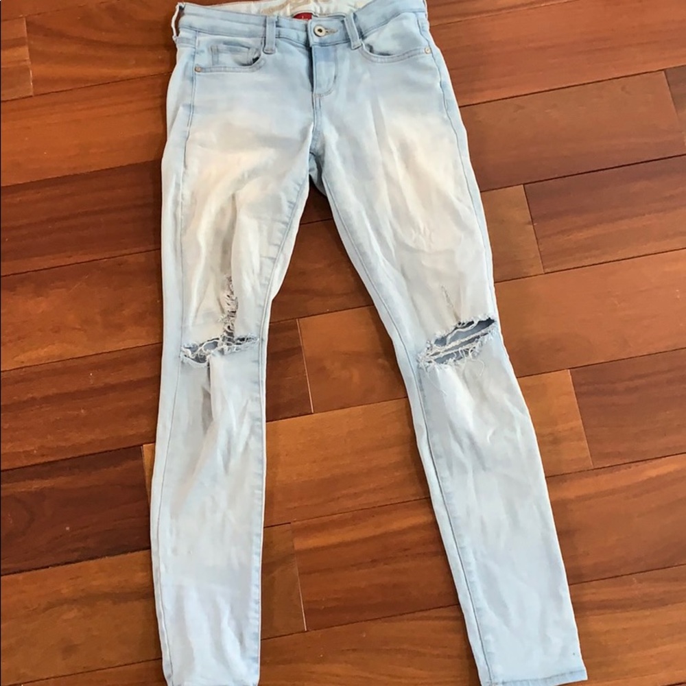 Light wash blue ripped jeans